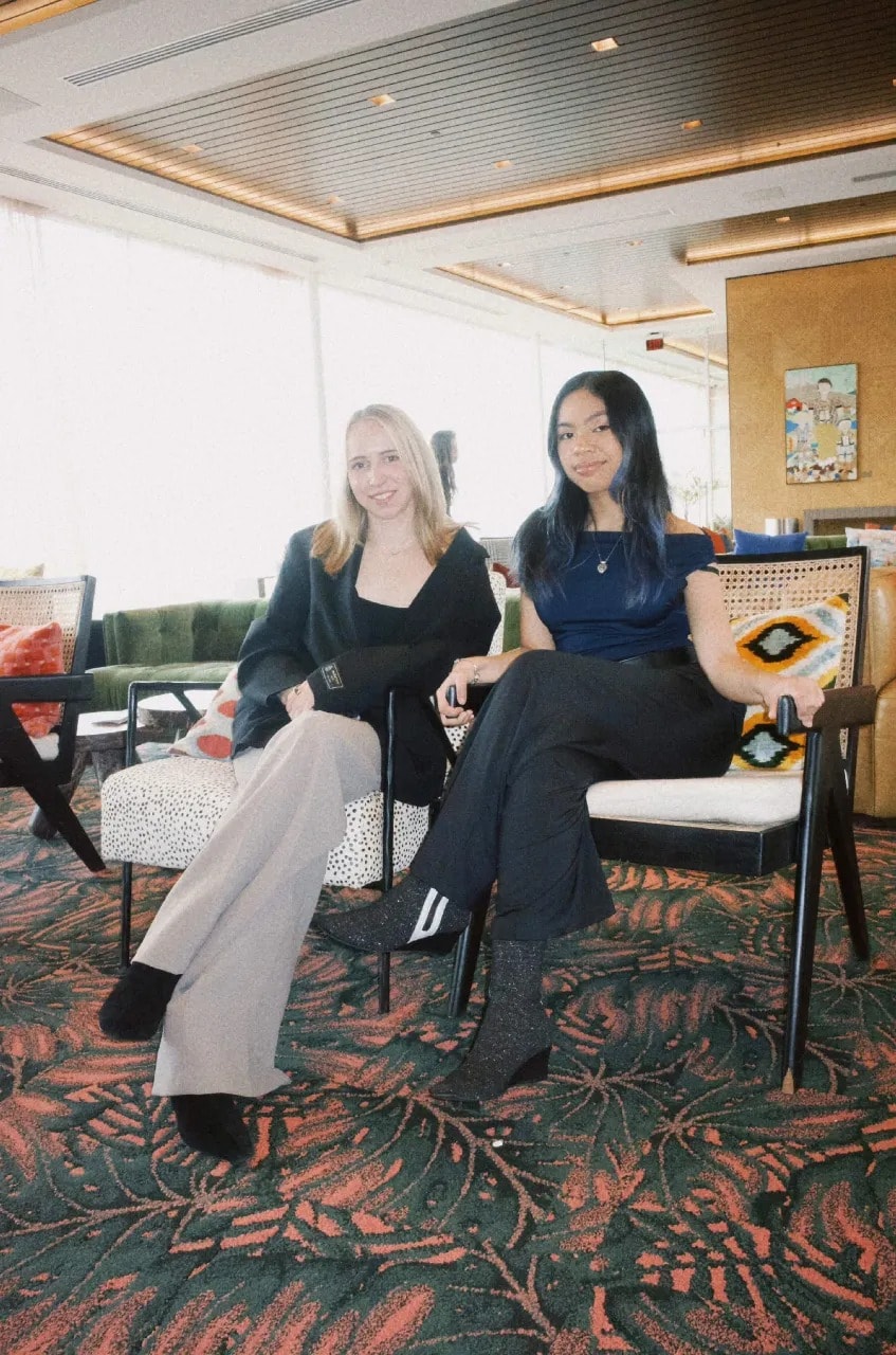 Audrey and her Deloitte project partner sitting together
