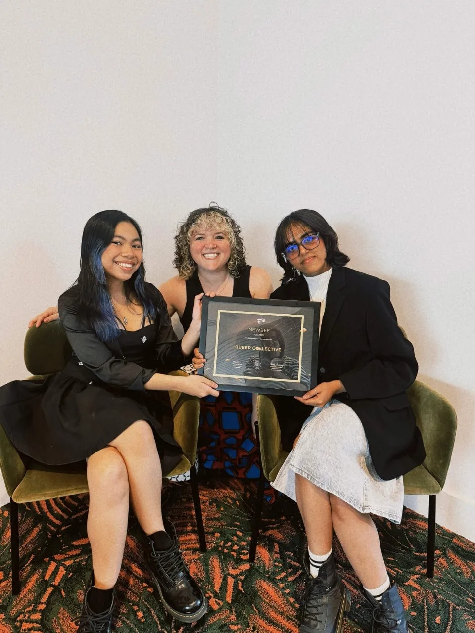 Audrey and two teammates holding a SCADHive award plaque