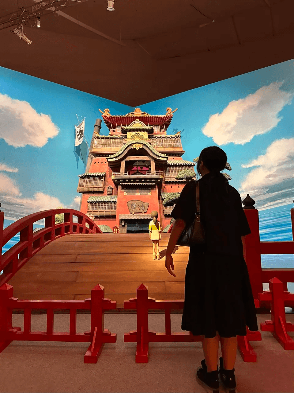 Audrey looking at a Spirited Away bathhouse art installation