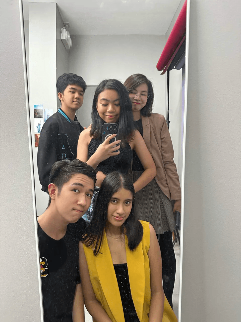 Audrey and friends taking a mirror selfie